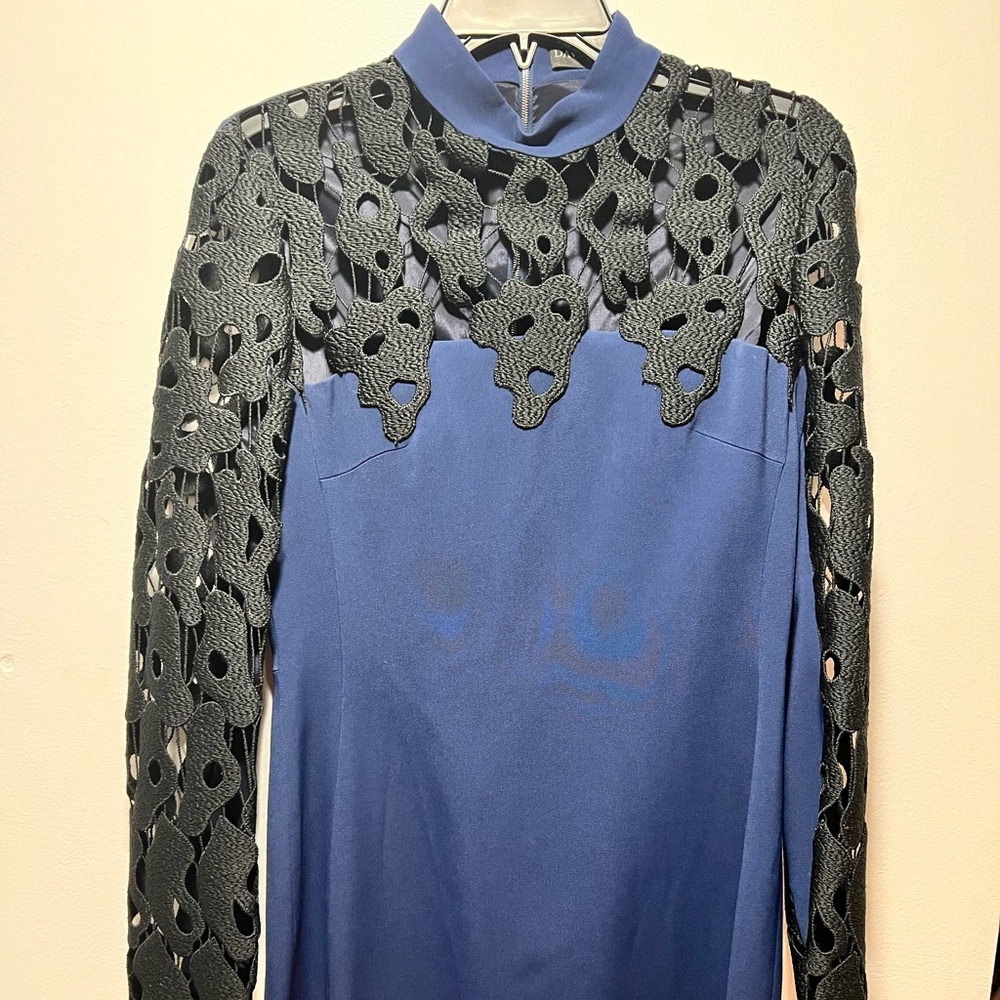 David Kona size 12 black and navy blue. Long sleeve, short length.